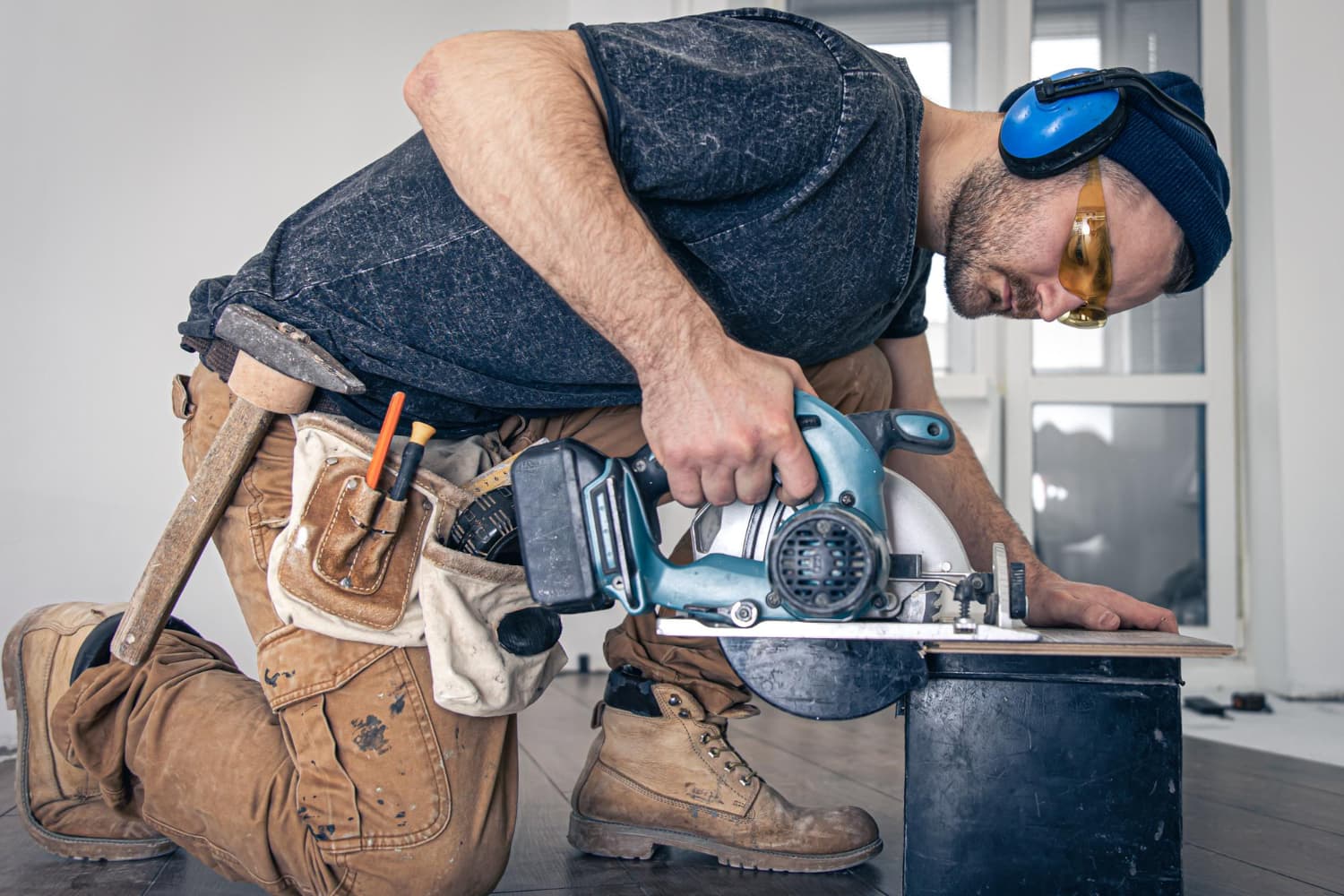 Professional handyman carrying tools